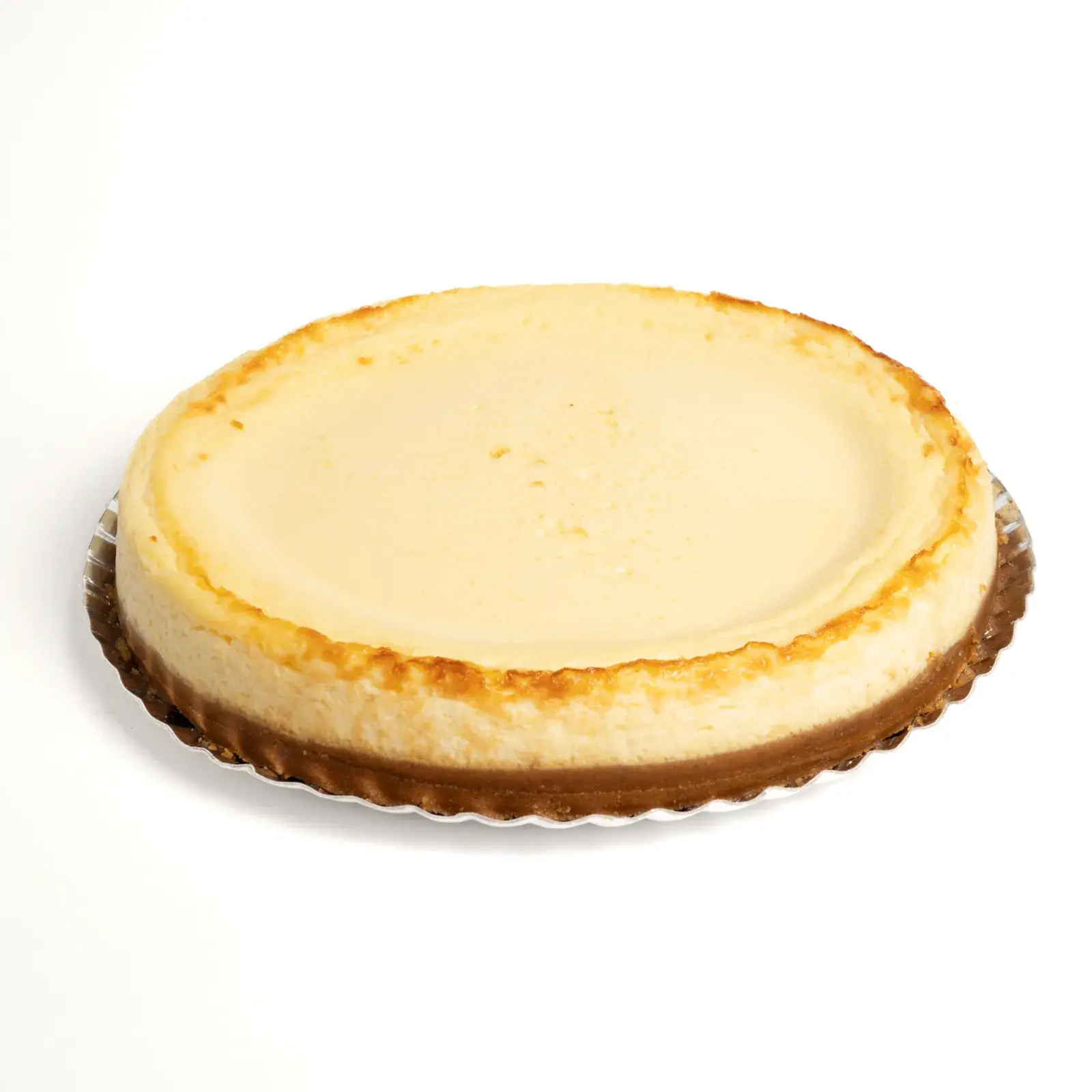 Tarta de queso tradicional entera, de superficie lisa y bordes dorados, de la categoría Queseras
